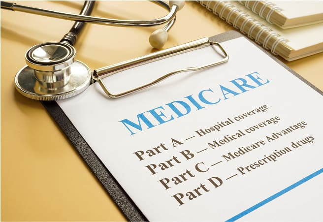 A stethoscope resting on a clipboard with a Medicare document titled 